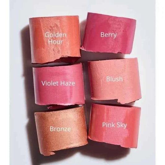 Six lipstick bullet swatches arranged in a 2x3 grid on a white background, labeled Golden Hour, Berry, Violet Haze, Blush, Bronze, and Pink Sky.
