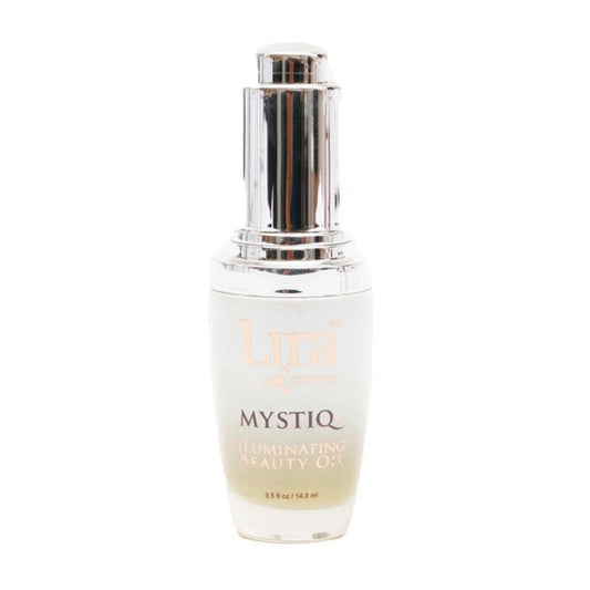 A bottle of Lira Mystiq Illuminating Beauty Oil with a reflective silver pump dispenser and a frosted white glass bottle, shown against a plain white background.