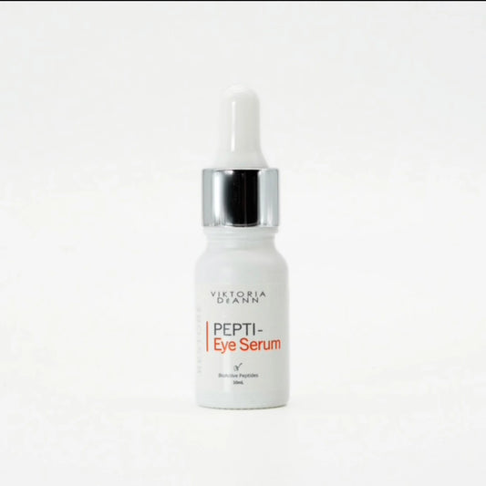 A 20ml dropper bottle of Victoria Dyann Pepti-Eye Serum, featuring a white bottle, a shiny silver collar, and a white dropper cap, set against a plain white background.