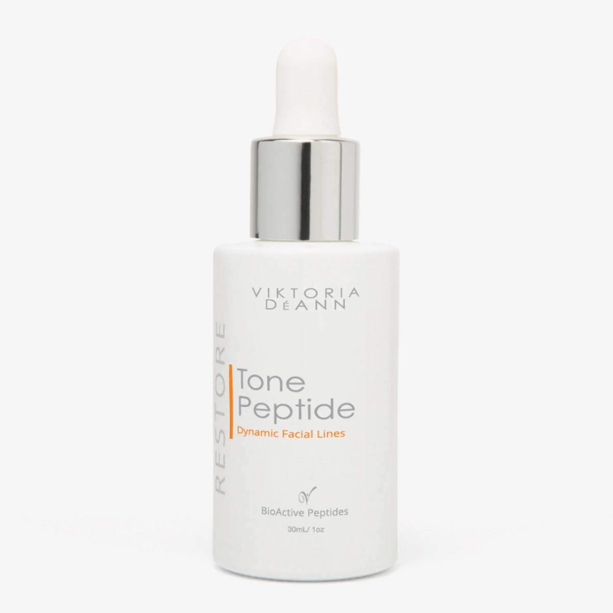 Viktoria Deann Restore Tone Peptide Dynamic Facial Lines serum in a white bottle with a silver dropper cap, on a light gray background.